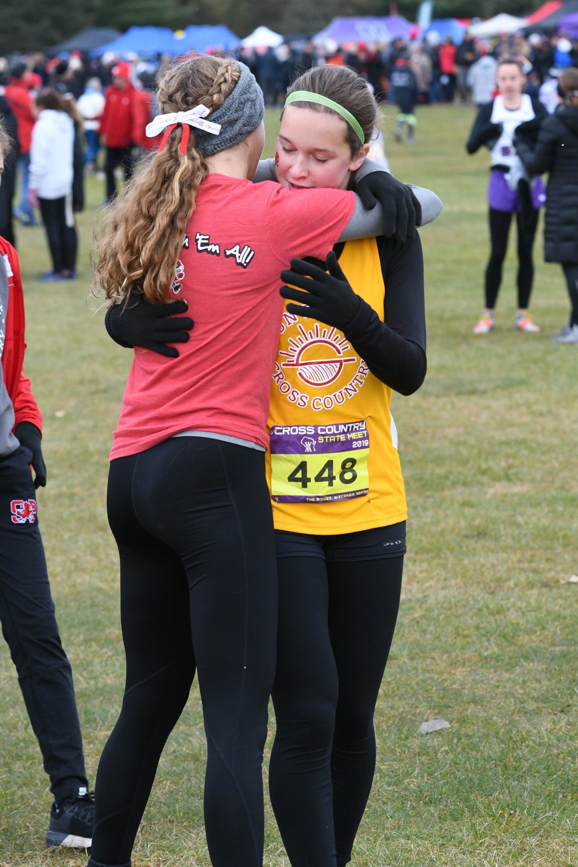 WIAA state cross country photo: Sun Prairie's Kate Kopotic hugs a teammate